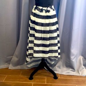 Stunning High-Low black and white long skirt is size XL. Great elastic waist.